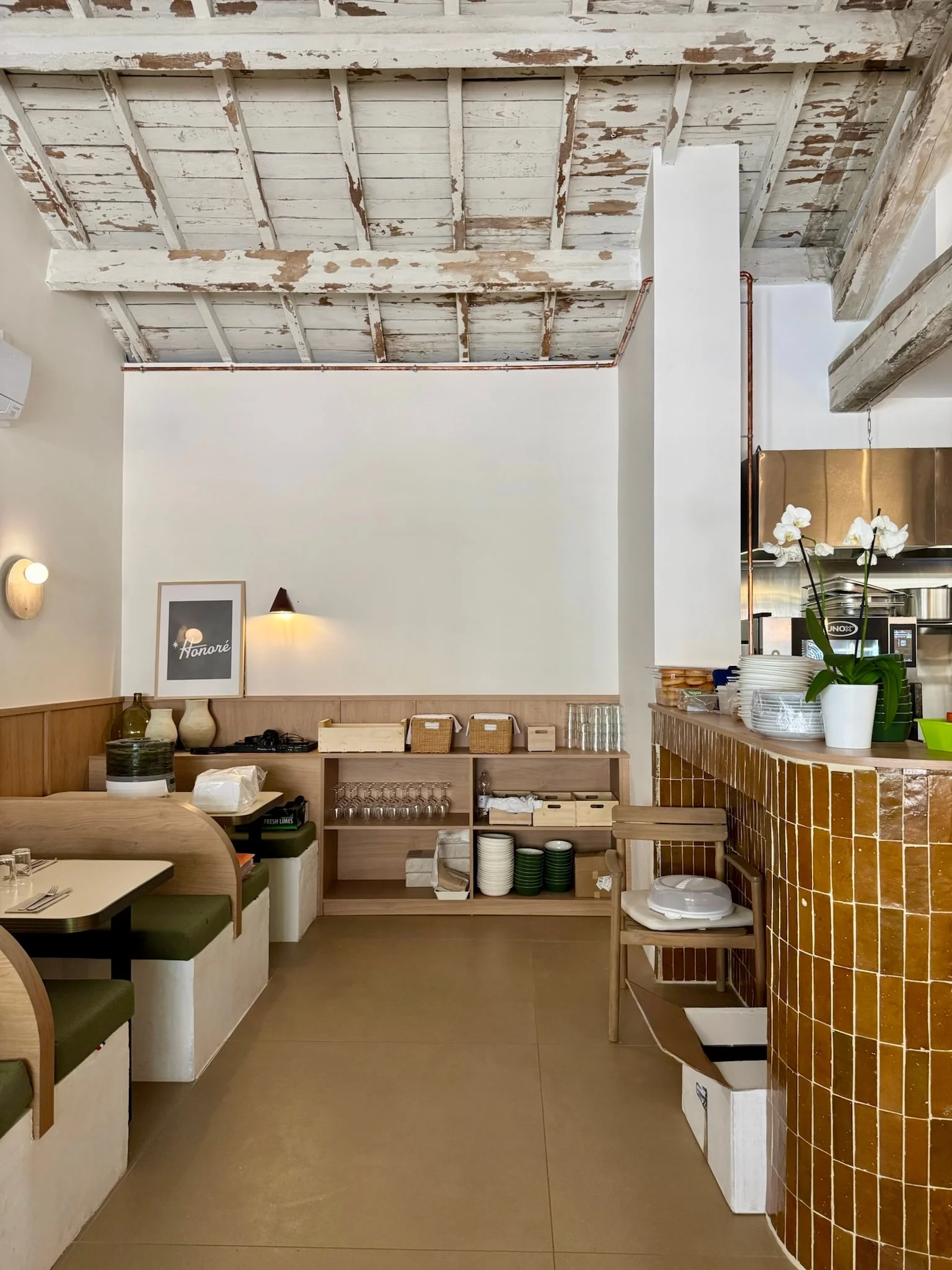 Booths along the wall and open shelving — Honoré Brunch