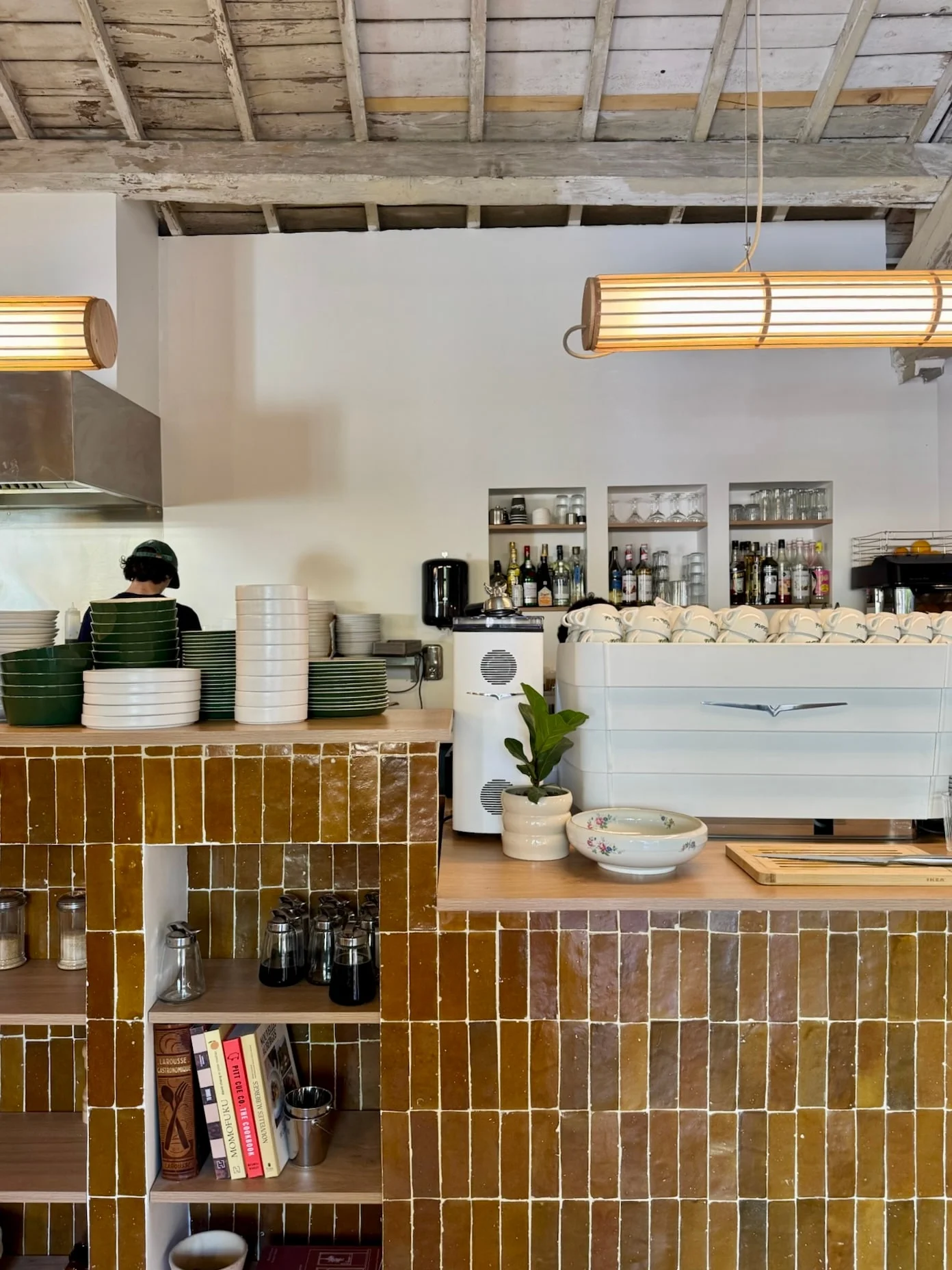 Kitchen pass behind the zellige counter — Honoré Brunch