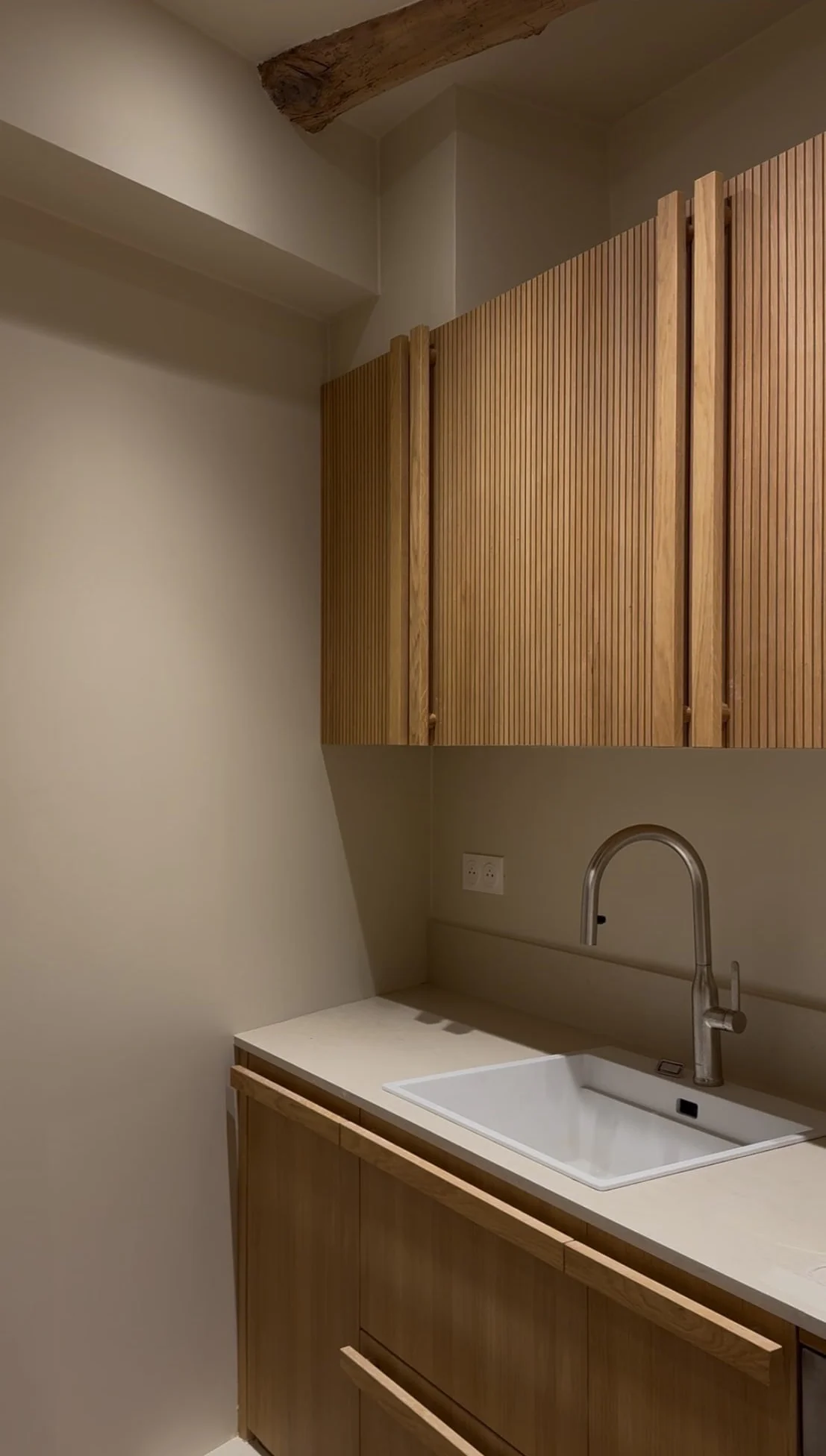 Kitchen with fluted oak cabinets — Petite Fontaine