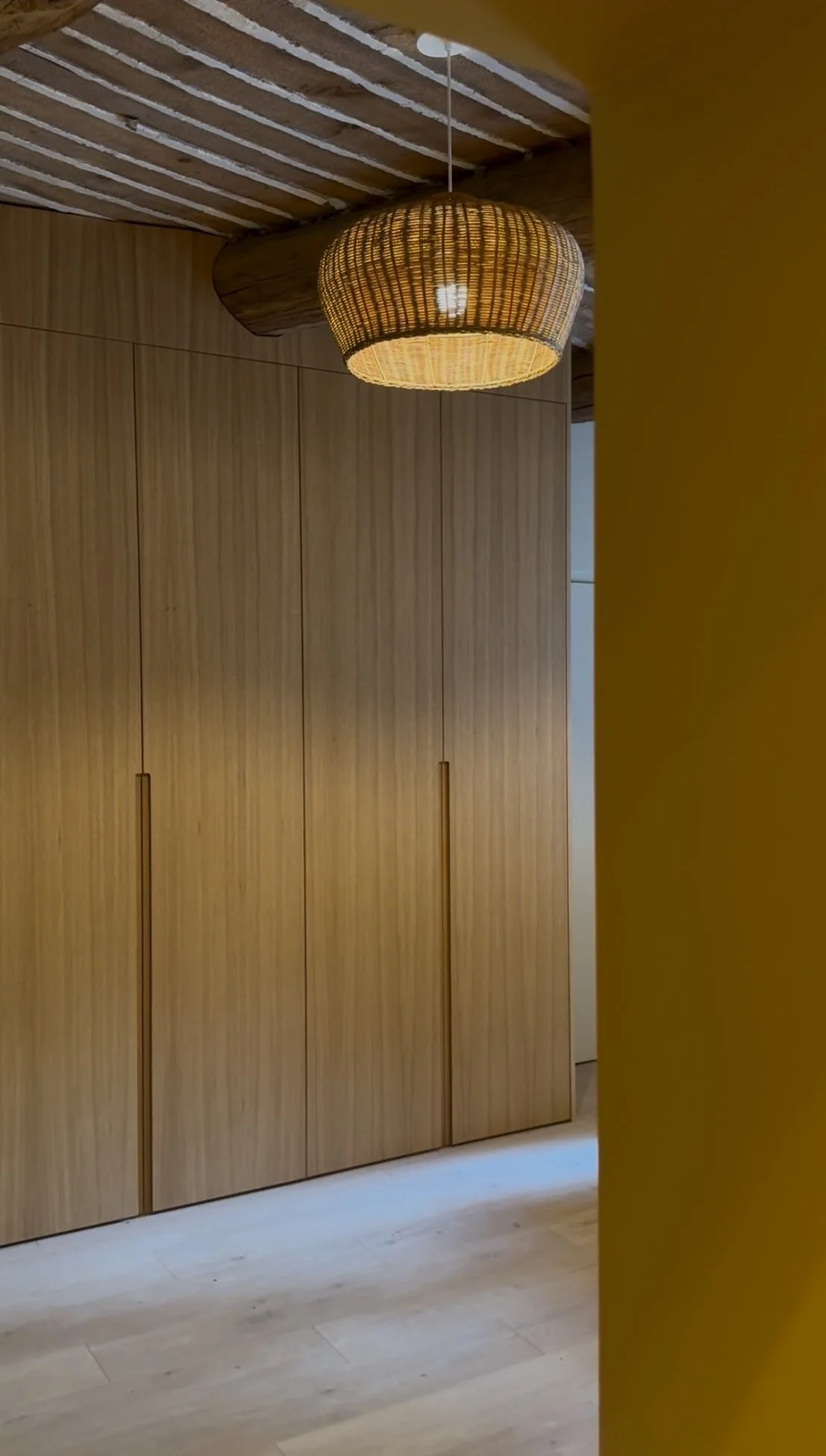 Full-height oak wardrobes and woven pendant light — Petite Fontaine